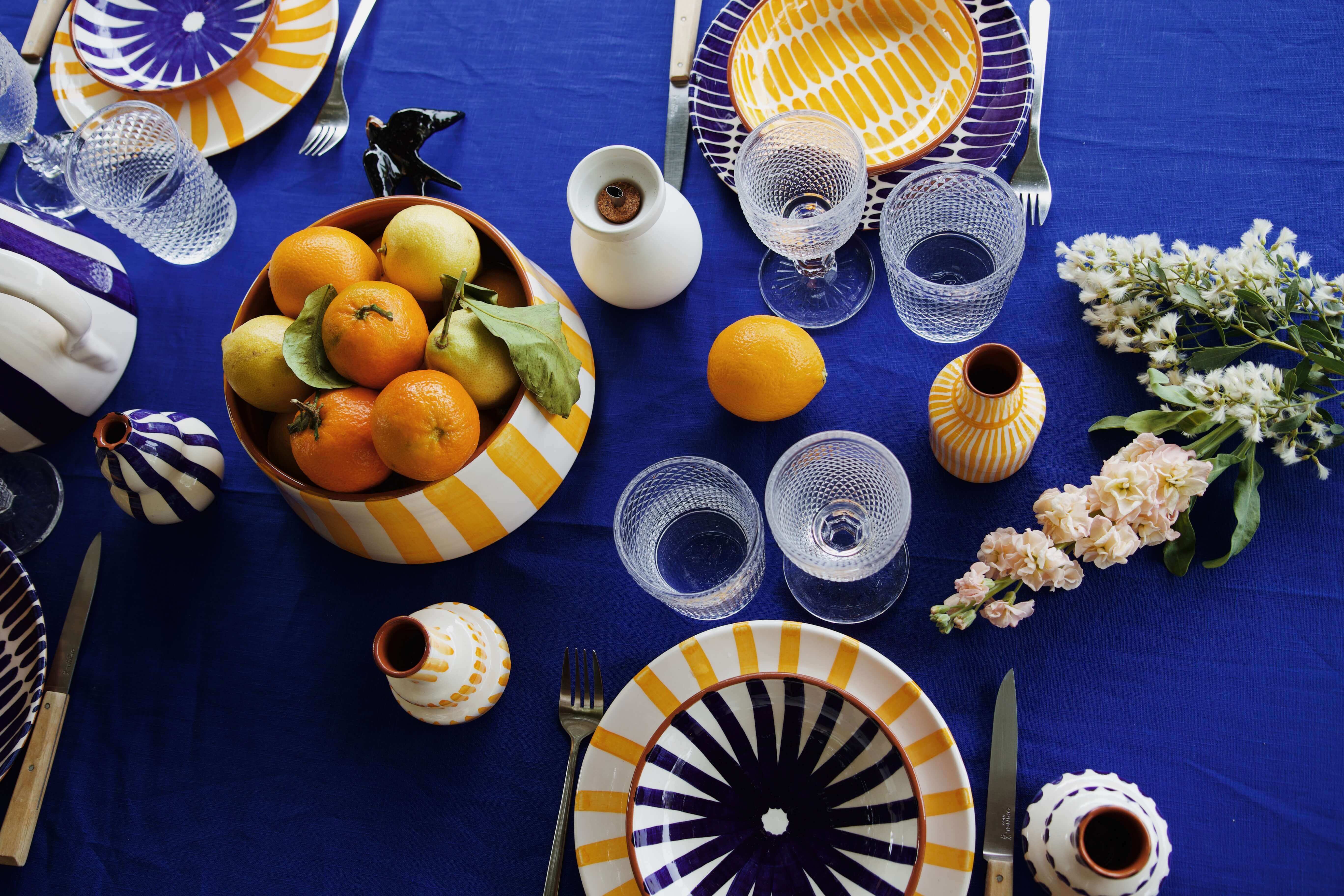 Two women in striped dresses